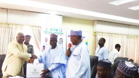 Chairman of NNDC (middle) presenting a business plan to Rt. Hon. Simon Achuba, Deputy Gov. Kogi State