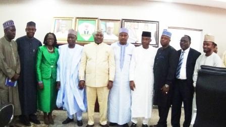 NNDC's Management in a group photograph with officials of Kogi State Government. Rt. Hon. Simon Achuba, Deputy Governor (3rd left)